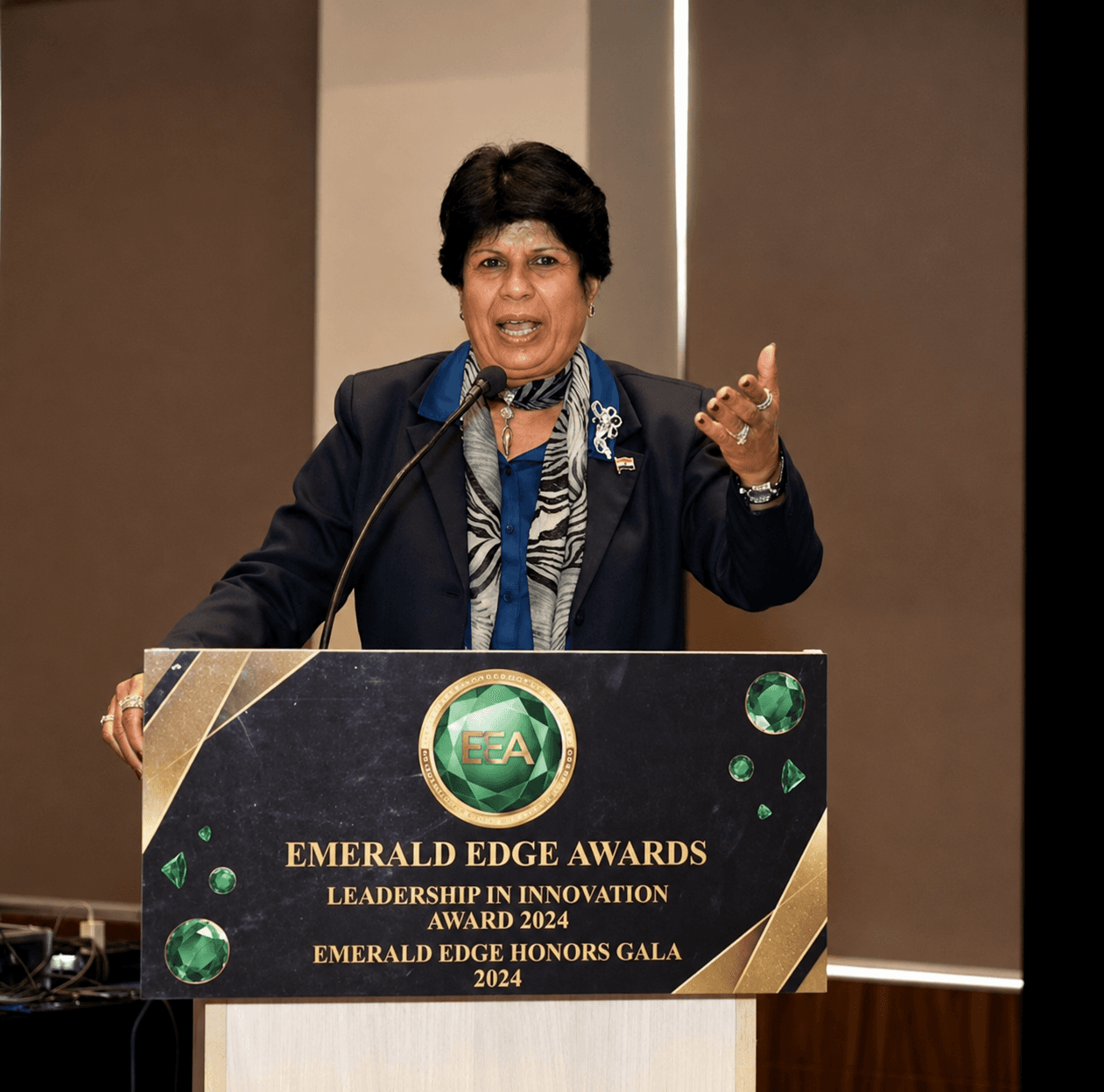 Speaker at an Emerald Edge Awards branded podium